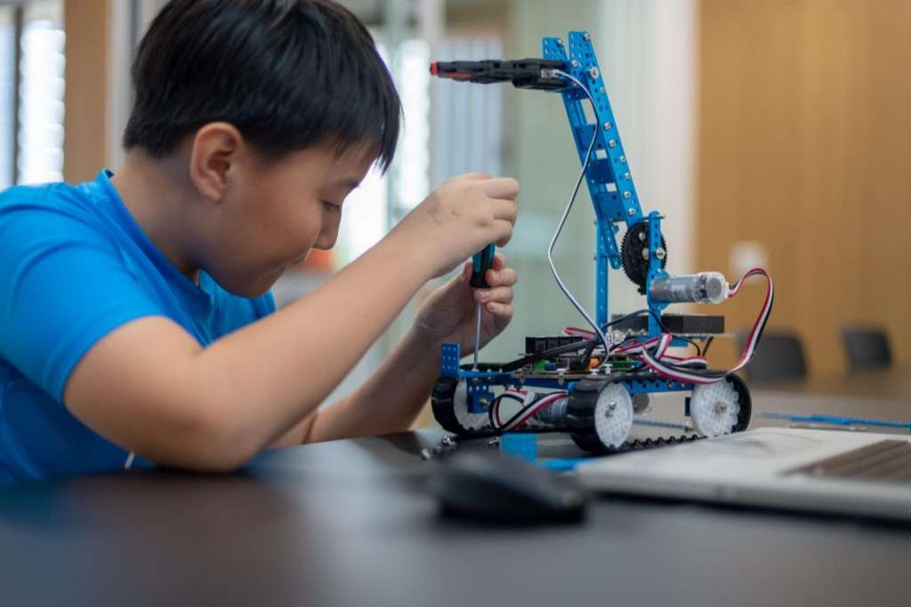 Student building a robot at Roboto Coding Academy